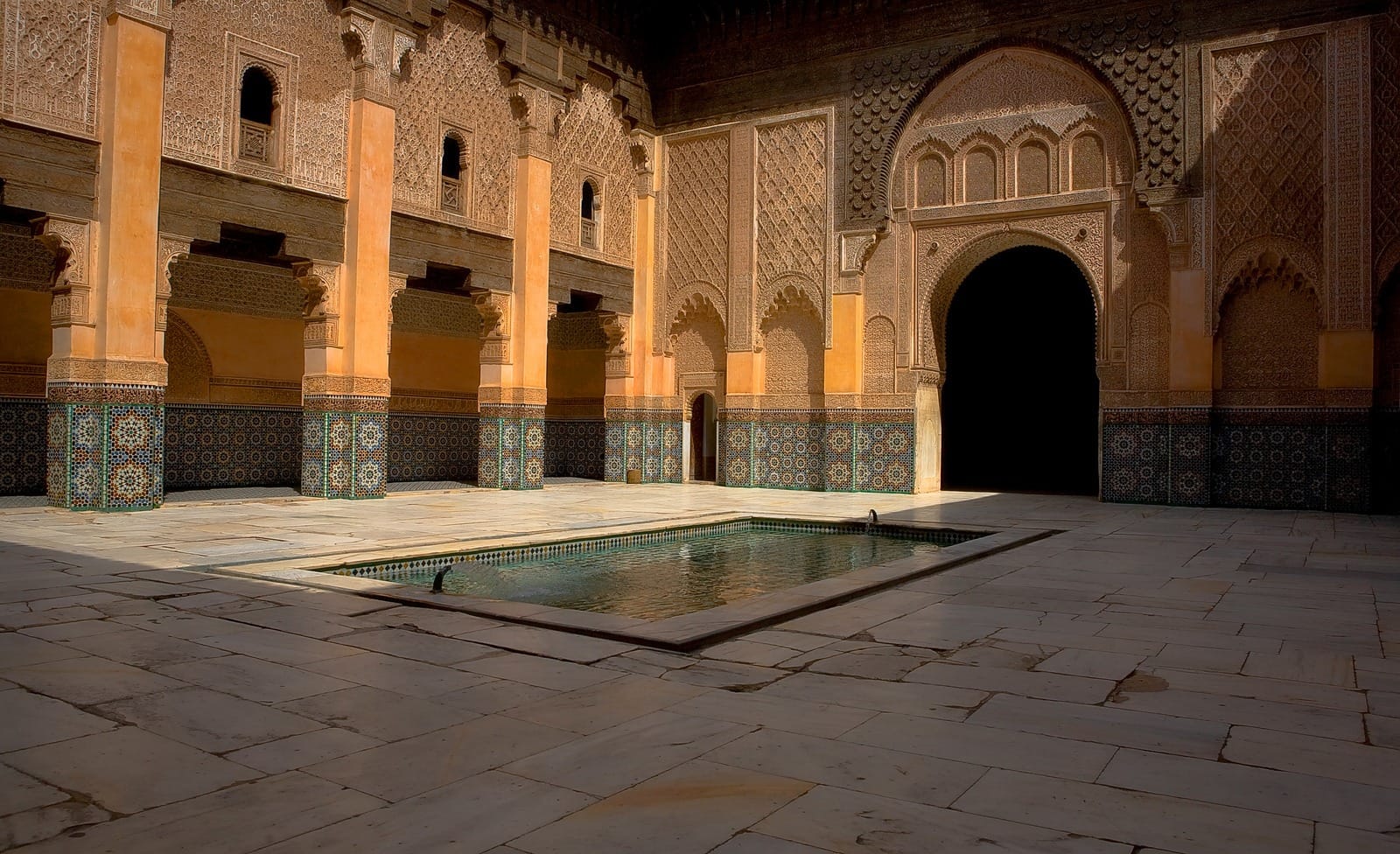 Marble courtyard and zellige reflecting pool at Ben Youssef Madrasa, Marrakech