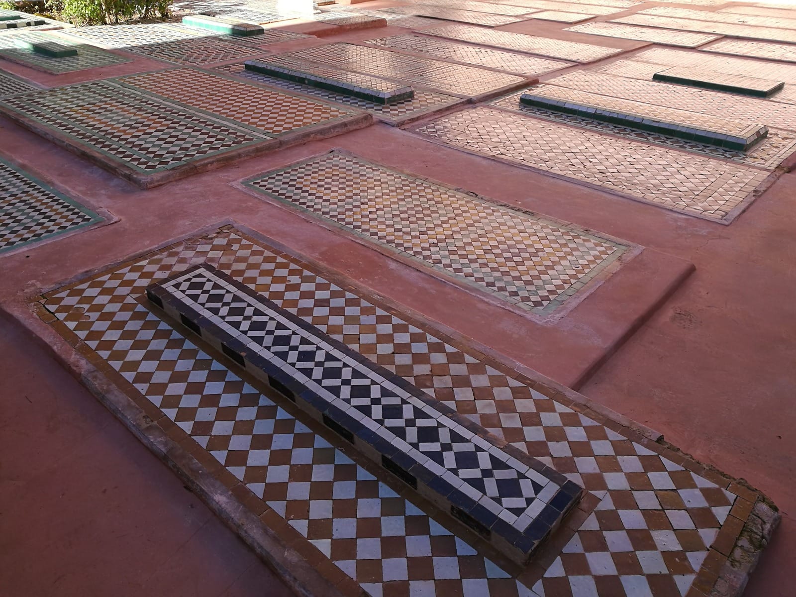 Zellige-tiled graves in the garden courtyard of the Saadian Tombs, Marrakech